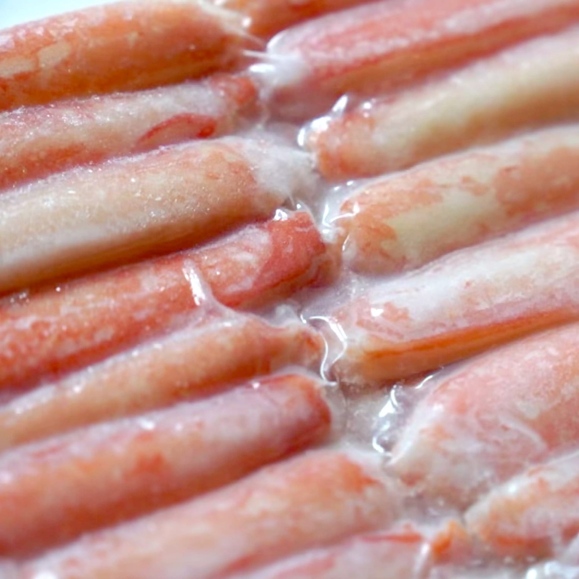 Snow Crab Leg Meat - close up photo frozen in packaging showing red colors - order fresh seafood online buy shellfish home delivery riviera seafood club