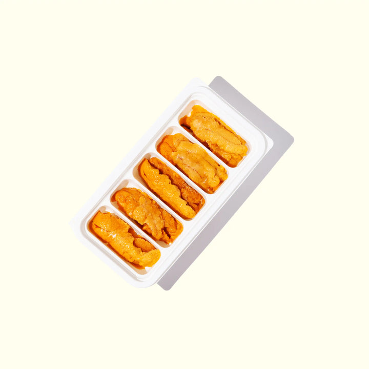 Wild-Caught Uni (Sea Urchin) (A Grade) - over head photo in packaging and bright orange color - order fresh seafood online buy sushi sashimi grade shellfish home delivery riviera seafood club